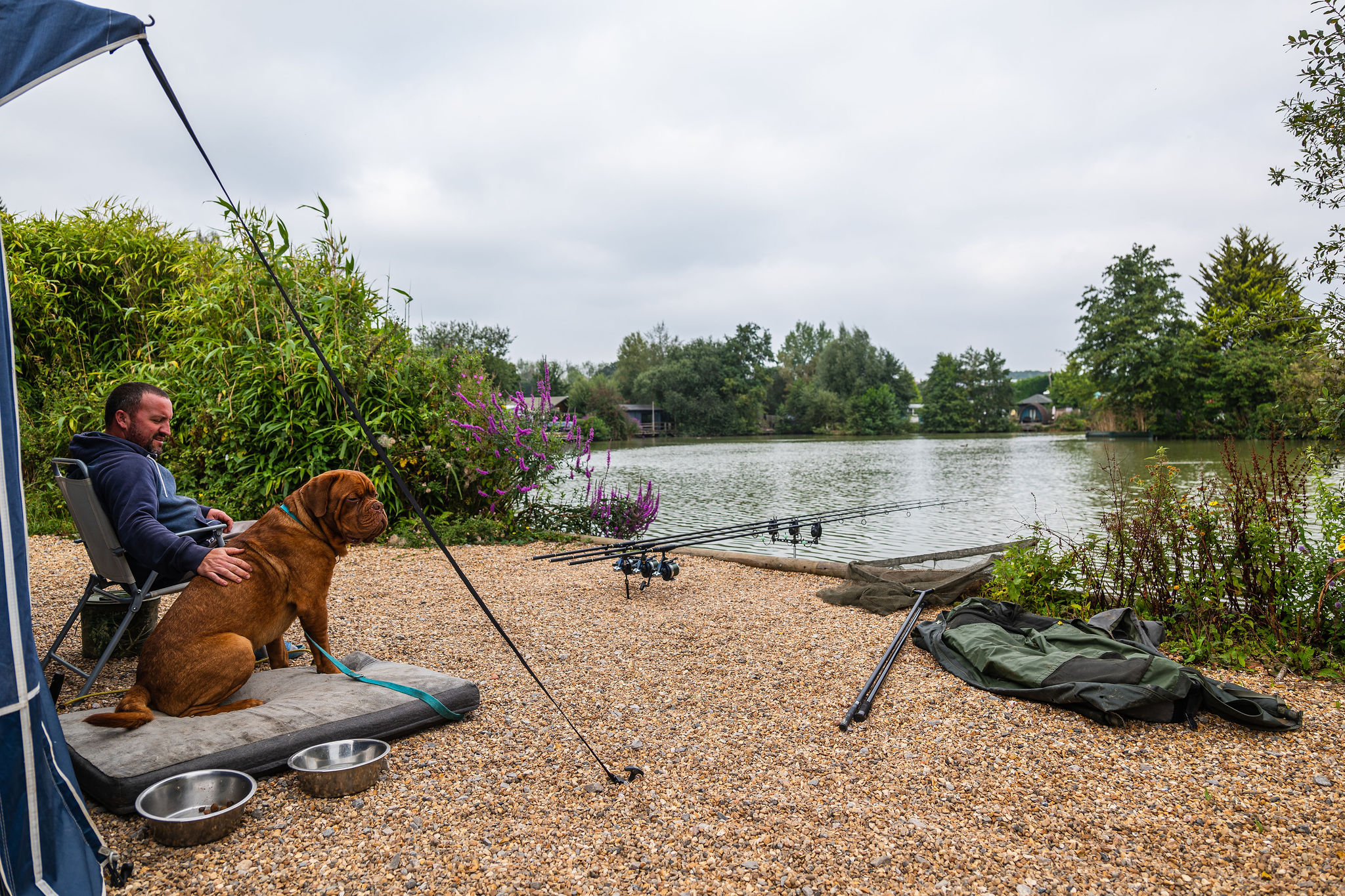 fishing holidays near me | man and his dog fishing at Sumners Ponds